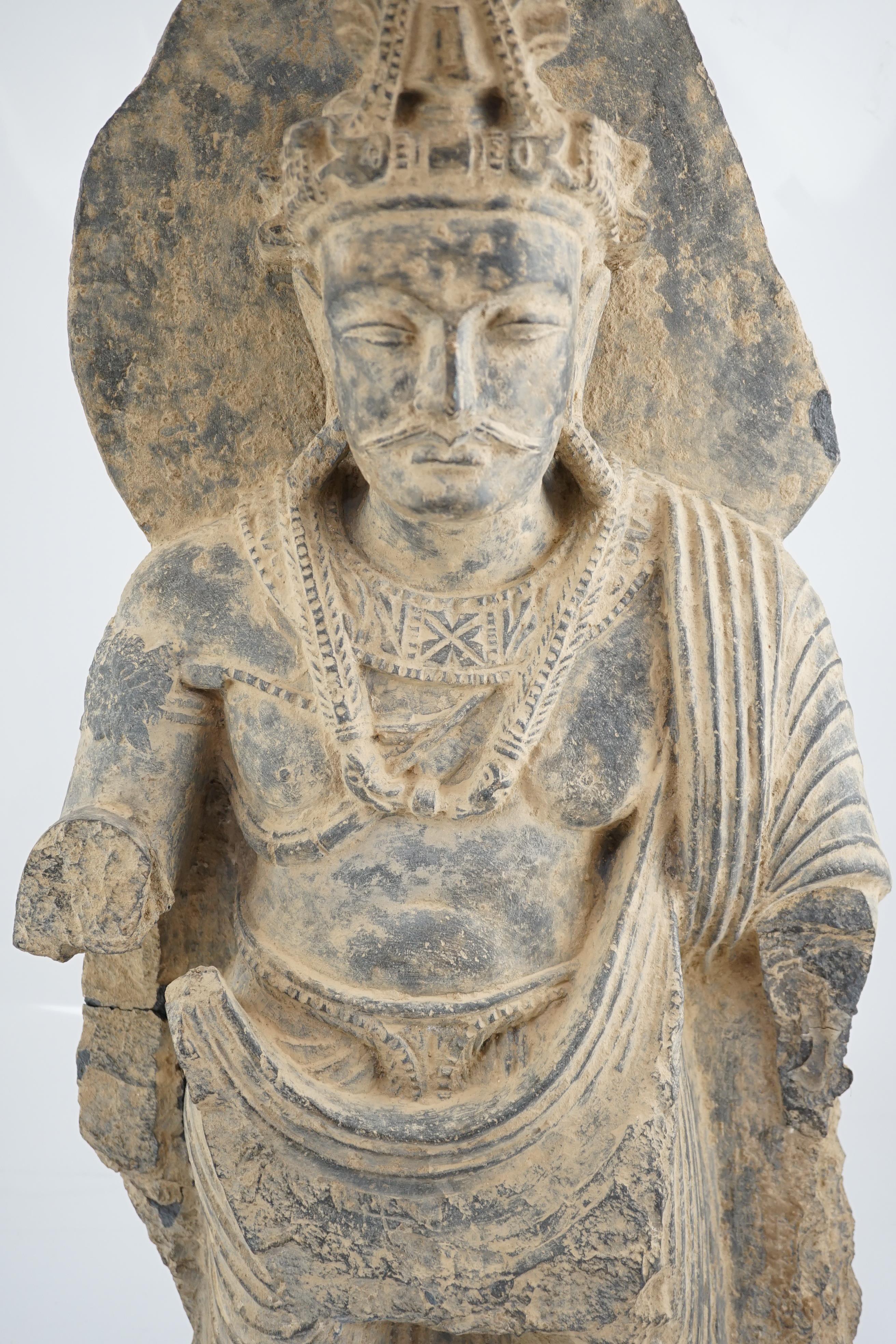 A large grey schist Bodhisattva figure, Gandhara, 2nd/3rd century A.D.